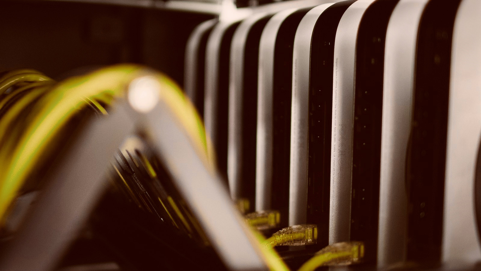 Mac mini servers and network cabling in a PixVPS data center